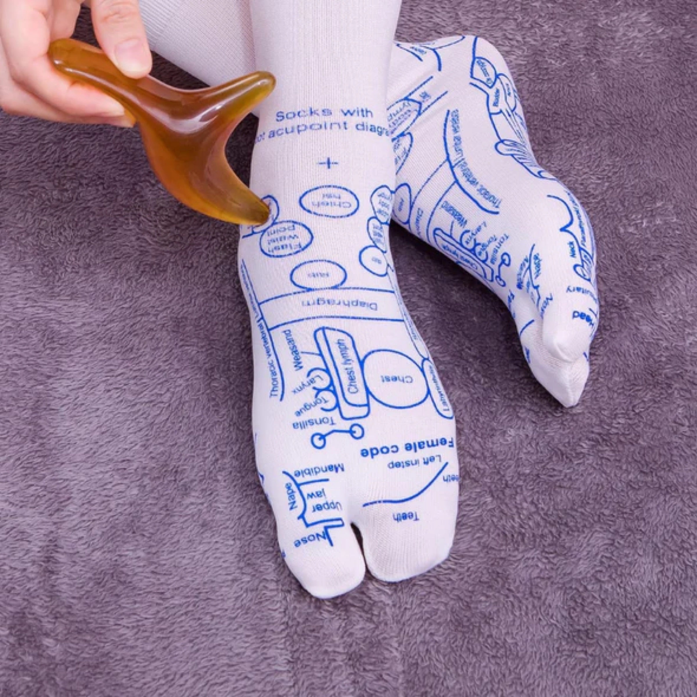 Reflexology socks with massage tool